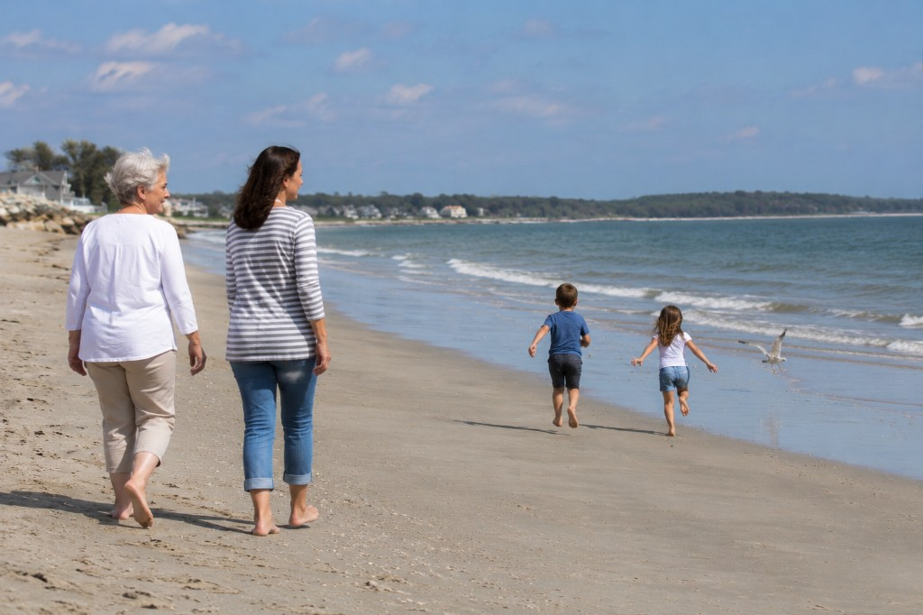 Multi-generational family walking on a sunny beach—life and final expense protection across generations